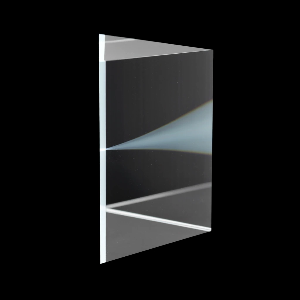 A triangular prism of optical glass with a single blade of light passing through it